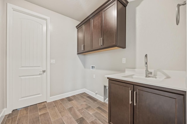974 Talus Way S, Madera, CA 93636 - laundry room with washer hookup, cabinet space, wood finish floors, and hookup for a gas dryer