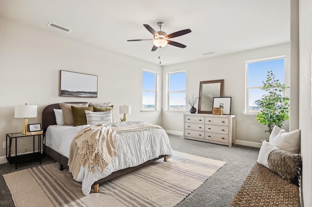974 Talus Way S, Madera, CA 93636 - carpeted bedroom featuring multiple windows and ceiling fan