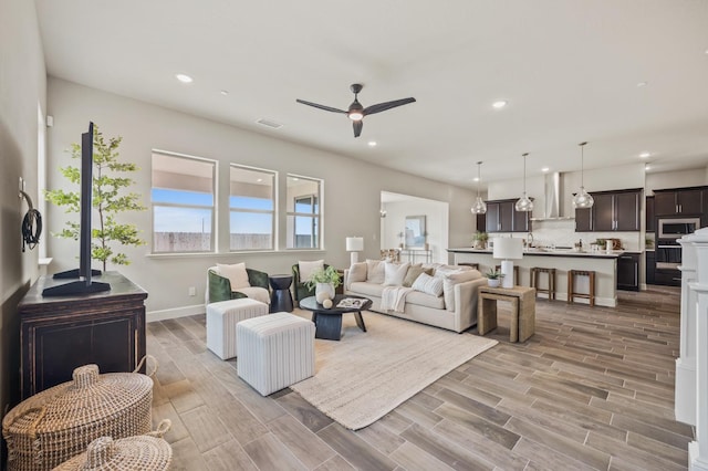 974 Talus Way S, Madera, CA 93636 - living room featuring ceiling fan, recessed lighting, and light wood-style flooring