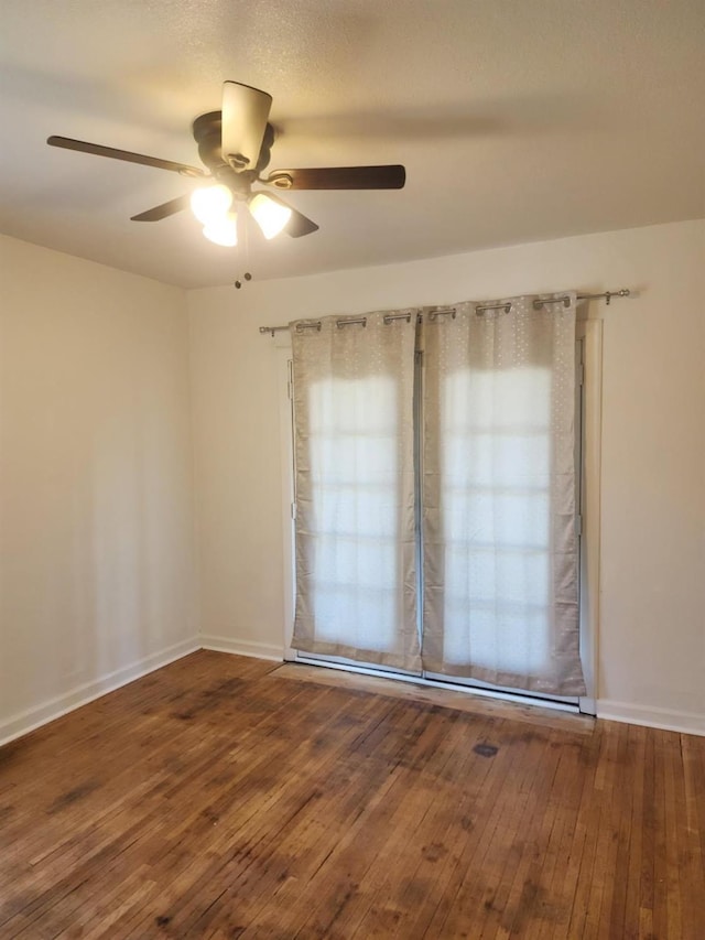 5288 N Piedra Rd N, Sanger, CA 93657 - unfurnished room with ceiling fan and wood-type flooring