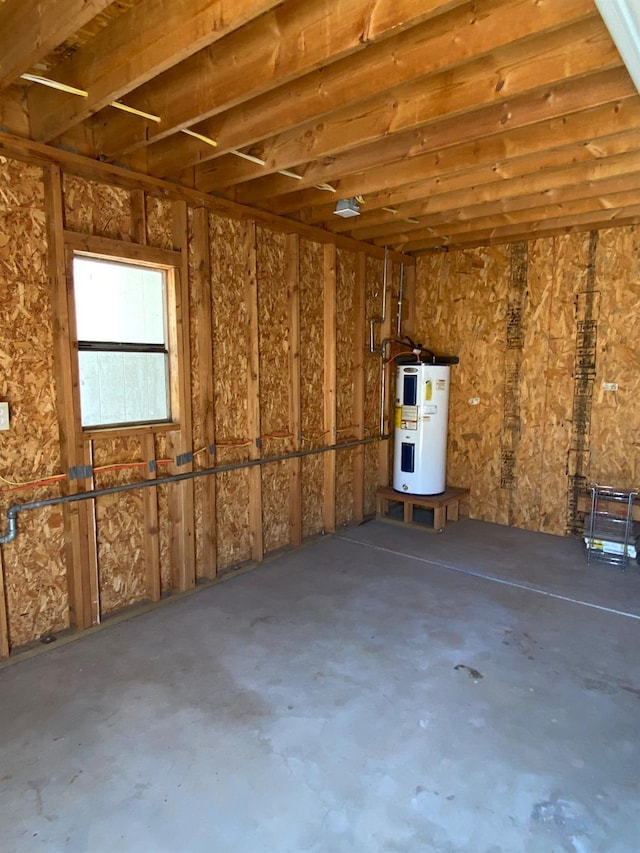 5288 N Piedra Rd N, Sanger, CA 93657 - miscellaneous room with electric water heater, concrete floors, and a garage