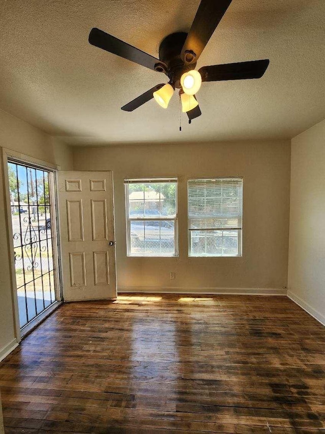 5288 N Piedra Rd N, Sanger, CA 93657 - foyer featuring a textured ceiling, wood finished floors, and a ceiling fan