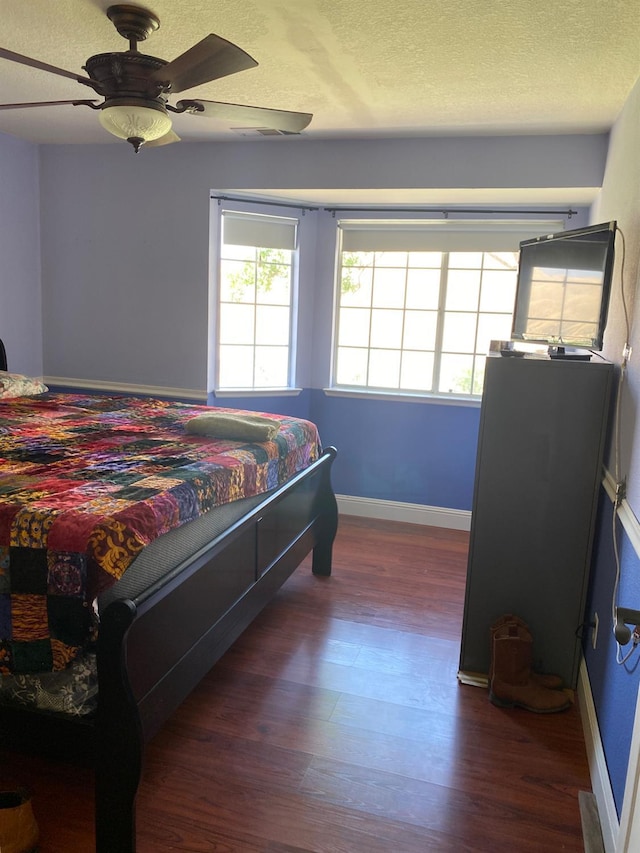 5288 N Piedra Rd N, Sanger, CA 93657 - bedroom with wood finished floors, a textured ceiling, and a ceiling fan