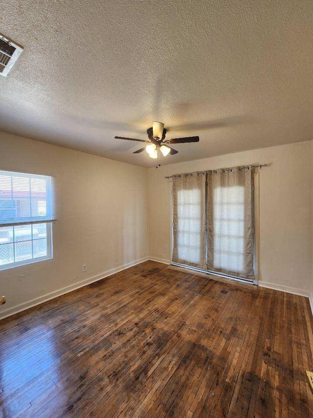 5288 N Piedra Rd N, Sanger, CA 93657 - unfurnished room featuring wood-type flooring, a textured ceiling, and a ceiling fan