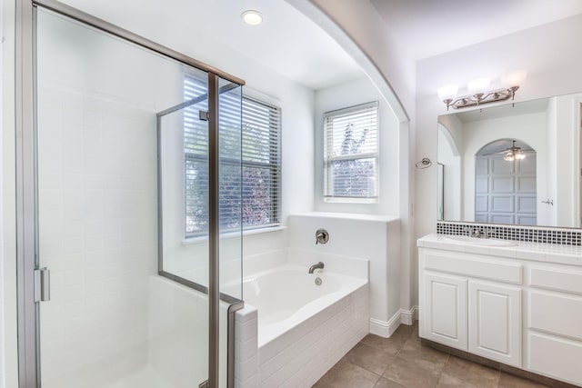 1090 Clara Ave, Fowler, CA 93625 - bathroom featuring a shower stall, a bath, vanity, and tile patterned floors