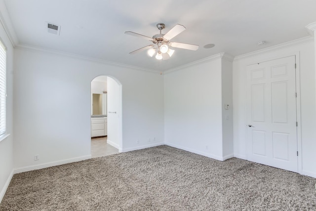 1090 Clara Ave, Fowler, CA 93625 - unfurnished room featuring arched walkways, light carpet, a ceiling fan, crown molding, and a smoke detector