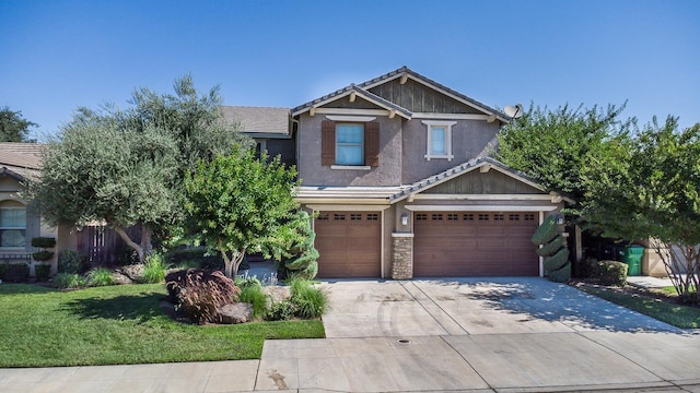 1090 Clara Ave, Fowler, CA 93625 - craftsman house with concrete driveway, stucco siding, an attached garage, a front lawn, and a tiled roof