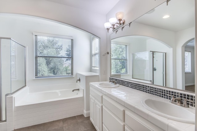 1090 Clara Ave, Fowler, CA 93625 - bathroom with a garden tub, double vanity, tile patterned floors, and a shower stall