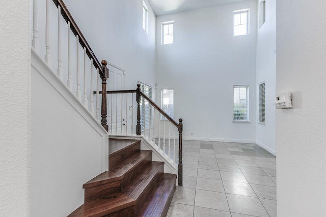 1090 Clara Ave, Fowler, CA 93625 - staircase with a high ceiling and tile patterned flooring