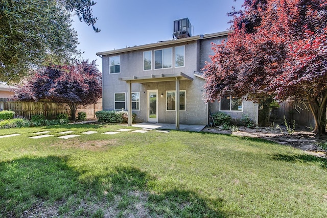 1090 Clara Ave, Fowler, CA 93625 - back of property featuring stucco siding, a fenced backyard, and a patio