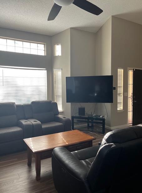 6324 N Brix, Fresno, CA 93722 - living area with a ceiling fan, a textured ceiling, and wood finished floors