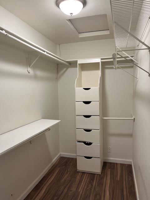 6324 N Brix, Fresno, CA 93722 - spacious closet with dark wood finished floors and attic access