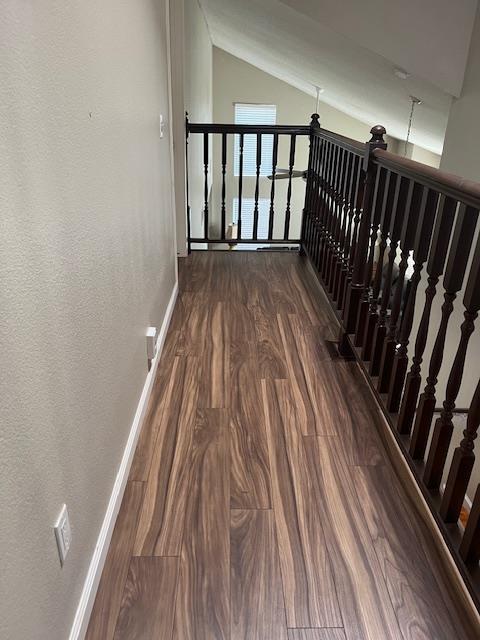 6324 N Brix, Fresno, CA 93722 - hallway with lofted ceiling and dark wood finished floors