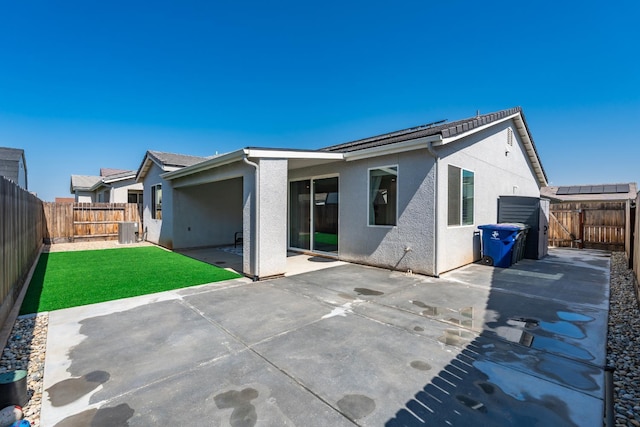 4146 Dennis Ave, Clovis, CA 93619 - rear view of property with a fenced backyard, stucco siding, and a patio