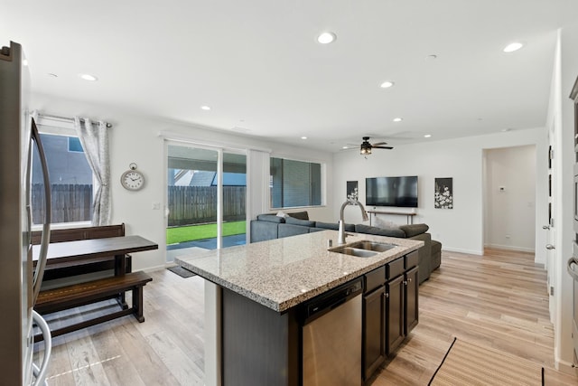 4146 Dennis Ave, Clovis, CA 93619 - kitchen featuring stainless steel dishwasher, light wood-style floors, a ceiling fan, light stone counters, and recessed lighting