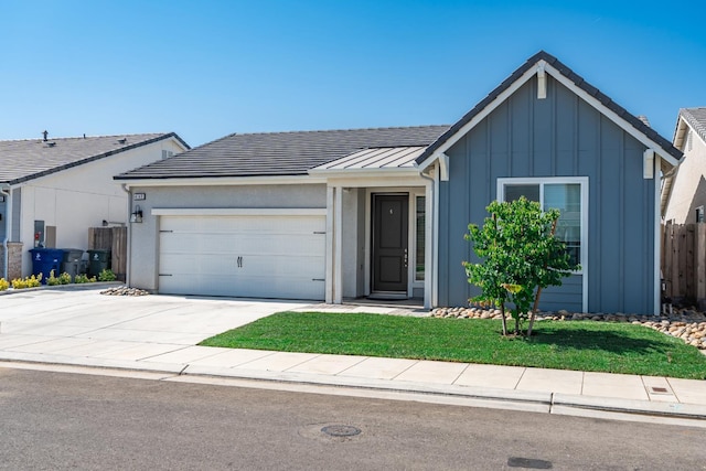 4146 Dennis Ave, Clovis, CA 93619 - ranch-style home with board and batten siding, an attached garage, concrete driveway, and a standing seam roof