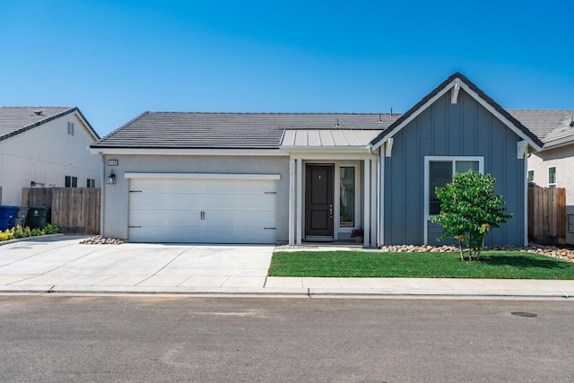 4146 Dennis Ave, Clovis, CA 93619 - ranch-style house with board and batten siding, a garage, and concrete driveway