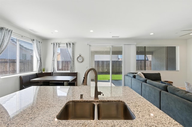 4146 Dennis Ave, Clovis, CA 93619 - kitchen featuring open floor plan, light stone counters, and recessed lighting