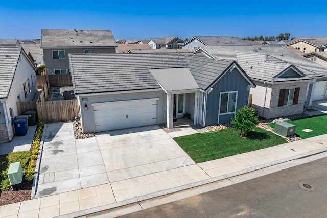 4146 Dennis Ave, Clovis, CA 93619 - view of front of property with a residential view, board and batten siding, concrete driveway, a garage, and a tile roof