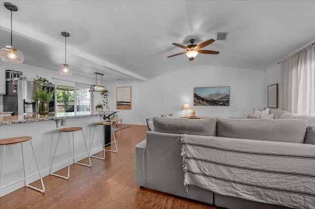 1448 Ashcroft Ave, Clovis, CA 93611 - living area featuring ceiling fan, dark wood-type flooring, and vaulted ceiling