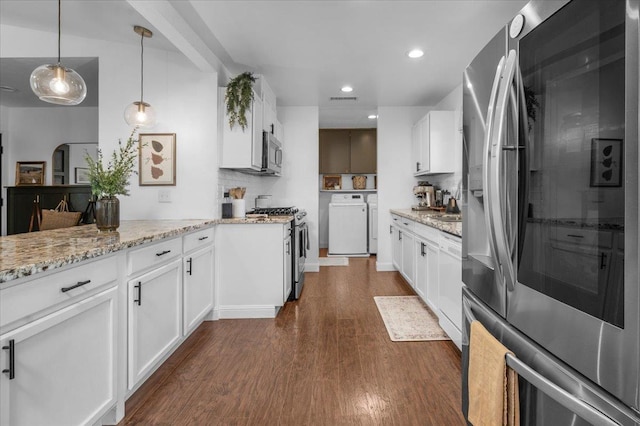 1448 Ashcroft Ave, Clovis, CA 93611 - kitchen with appliances with stainless steel finishes, independent washer and dryer, dark wood-style flooring, white cabinets, and recessed lighting