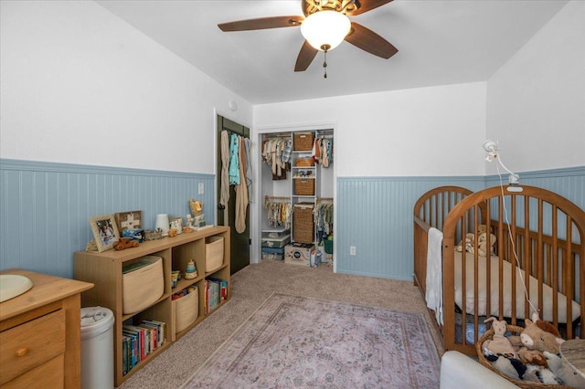 1448 Ashcroft Ave, Clovis, CA 93611 - bedroom featuring wainscoting, carpet floors, a closet, and ceiling fan