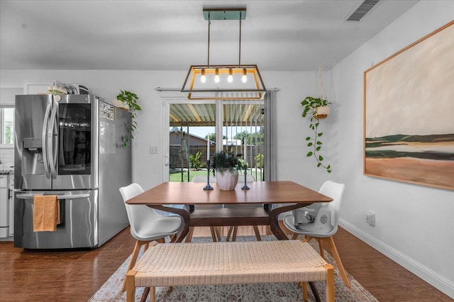 1448 Ashcroft Ave, Clovis, CA 93611 - dining room with dark wood-style flooring and baseboards
