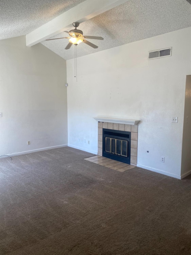 2673 N Marty Ave, Fresno, CA 93722 - unfurnished living room with carpet, ceiling fan, a textured ceiling, and a tile fireplace
