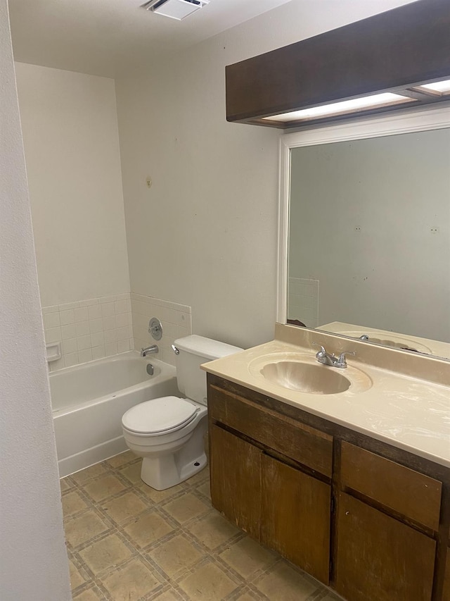2673 N Marty Ave, Fresno, CA 93722 - full bathroom featuring vanity, a tub to relax in, and tile patterned floors