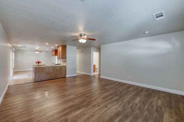 1437 N San Pablo Ave, Fresno, CA 93728 - unfurnished living room with ceiling fan, dark wood-style flooring, and recessed lighting