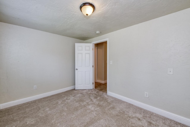 1437 N San Pablo Ave, Fresno, CA 93728 - spare room with carpet floors, a smoke detector, and a textured ceiling