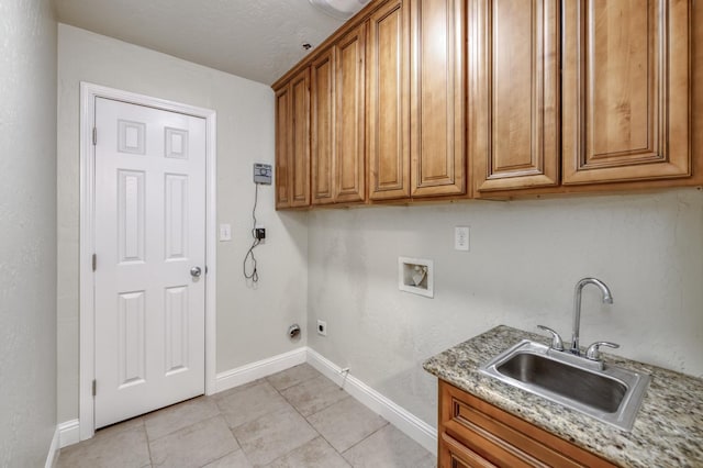 1437 N San Pablo Ave, Fresno, CA 93728 - laundry area with cabinet space, hookup for an electric dryer, washer hookup, and light tile patterned flooring