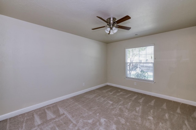 1437 N San Pablo Ave, Fresno, CA 93728 - carpeted spare room with baseboards and a ceiling fan