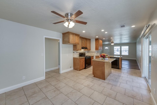 1437 N San Pablo Ave, Fresno, CA 93728 - kitchen featuring black appliances, a ceiling fan, recessed lighting, brown cabinets, and backsplash