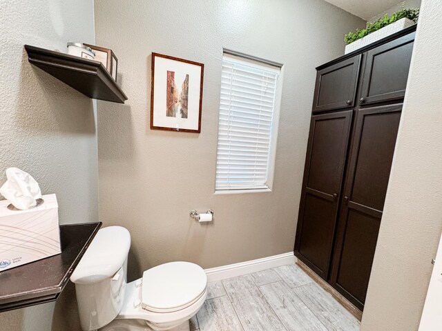 2457 Carson Ave, Clovis, CA 93611 - bathroom with toilet and wood finished floors