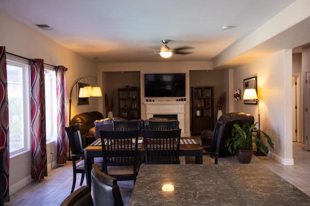 2457 Carson Ave, Clovis, CA 93611 - dining space featuring a fireplace and a ceiling fan