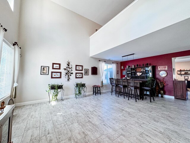 2457 Carson Ave, Clovis, CA 93611 - dining area featuring a towering ceiling, wood finished floors, and bar