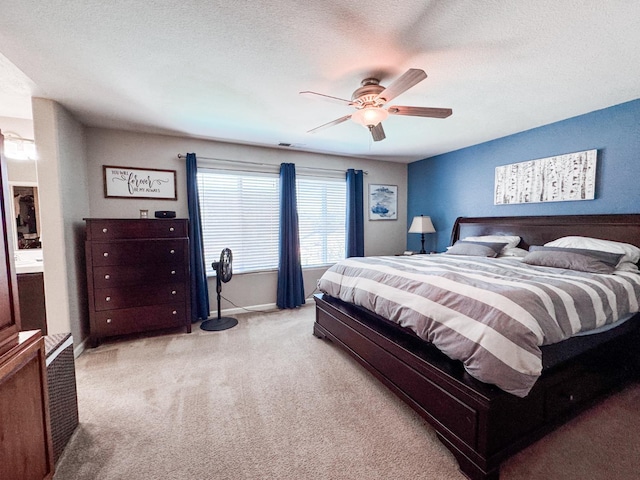 2457 Carson Ave, Clovis, CA 93611 - bedroom with light carpet, a ceiling fan, and a textured ceiling