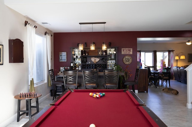 2457 Carson Ave, Clovis, CA 93611 - playroom with pool table, a dry bar, healthy amount of natural light, and wood finished floors