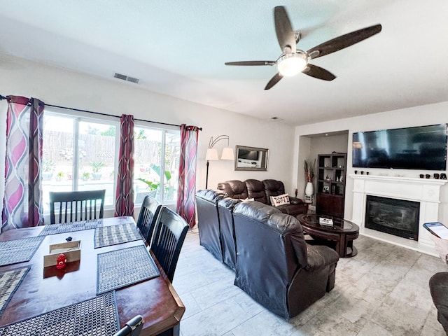 2457 Carson Ave, Clovis, CA 93611 - living area with a ceiling fan and a glass covered fireplace