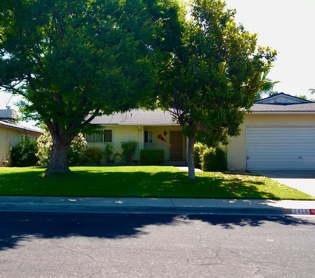 2415 Fordham Ave, Clovis, CA 93611 - view of front facade with an attached garage, driveway, and a front yard