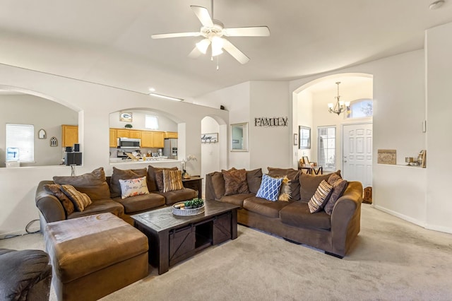 3787 Via Capitola, Madera, CA 93637 - living area featuring arched walkways, plenty of natural light, a chandelier, and light carpet