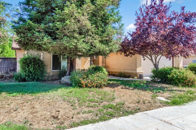 3787 Via Capitola, Madera, CA 93637 - obstructed view of property with stucco siding and an attached garage