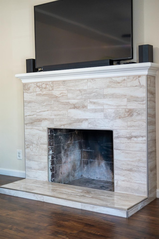 4115 E Montecito Ave, Fresno, CA 93702 - detailed view of wood finished floors and a fireplace with raised hearth