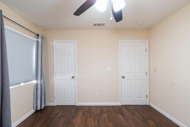 4115 E Montecito Ave, Fresno, CA 93702 - unfurnished bedroom featuring dark wood-style floors and a ceiling fan
