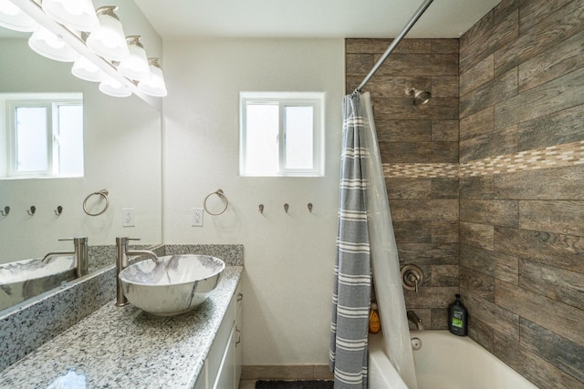 4115 E Montecito Ave, Fresno, CA 93702 - full bath featuring shower / bathtub combination with curtain and vanity