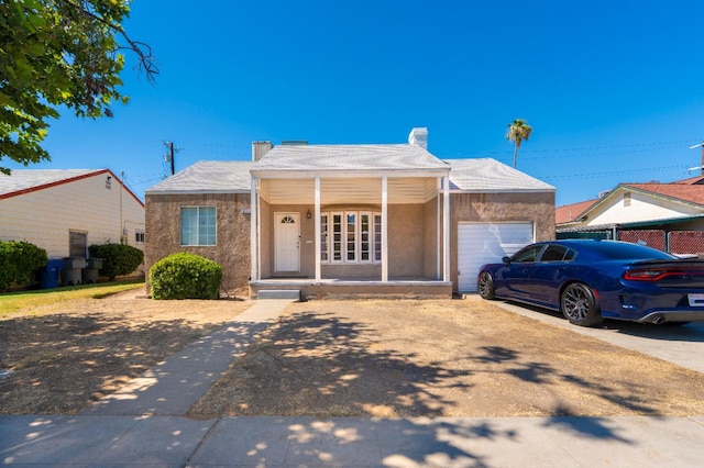 4115 E Montecito Ave, Fresno, CA 93702 - single story home with a garage, a porch, a chimney, and driveway