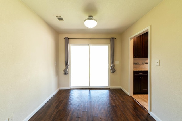 4115 E Montecito Ave, Fresno, CA 93702 - unfurnished room featuring healthy amount of natural light and dark wood-type flooring