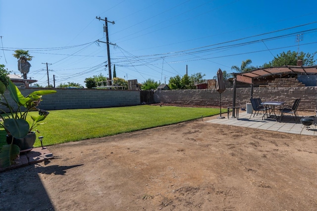 4115 E Montecito Ave, Fresno, CA 93702 - fenced backyard featuring a patio area
