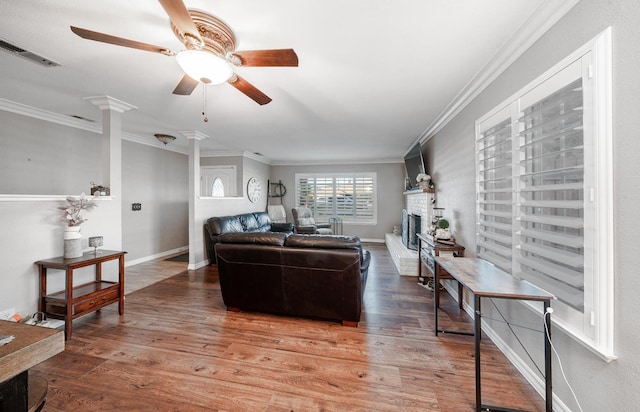 2816 Monocott, Madera, CA 93637 - living room with ceiling fan, crown molding, wood finished floors, and a fireplace